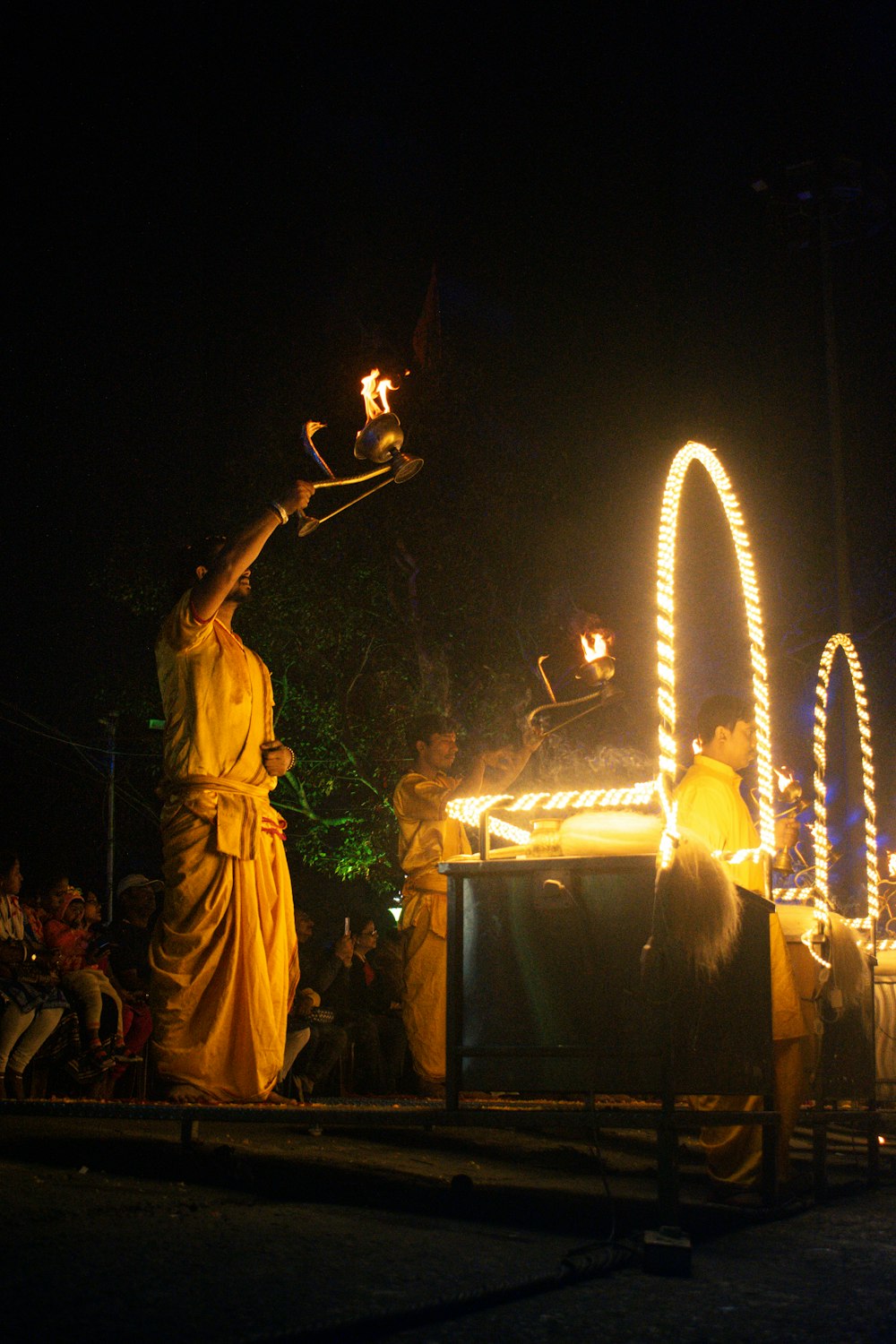 a statue of a woman holding a lit candle