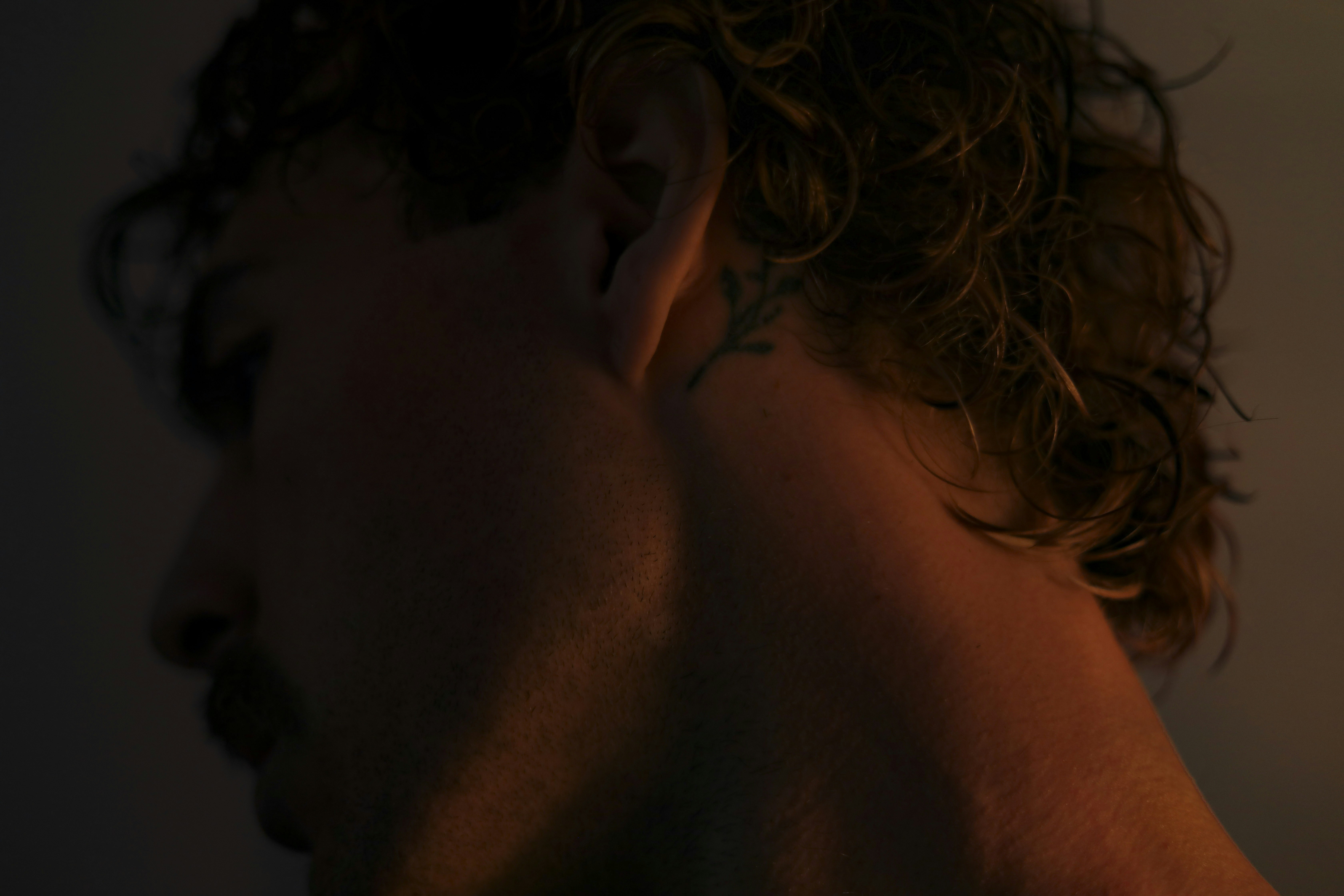 a man with a tattoo on his left ear