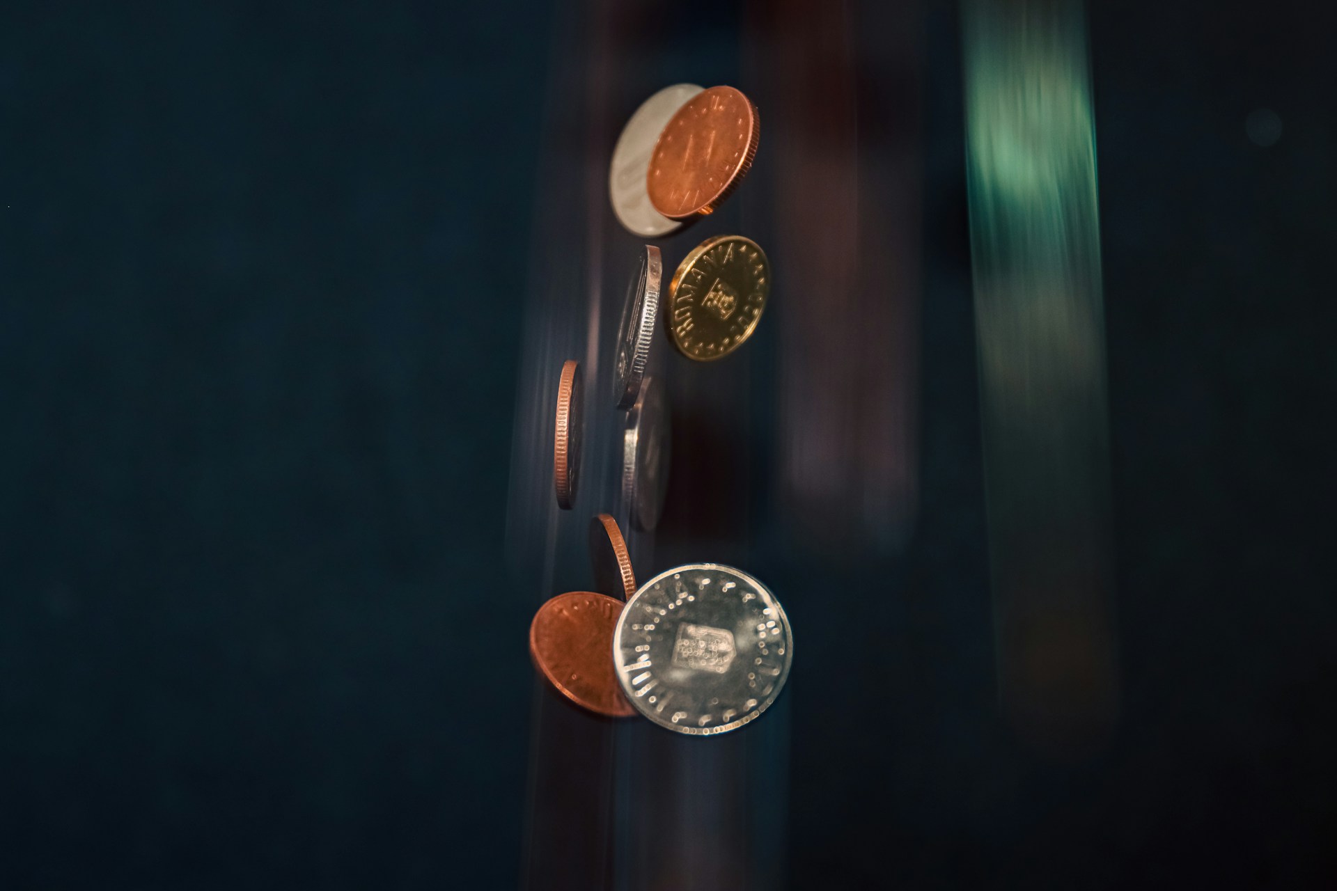 a close up of a clock with a bunch of coins on it