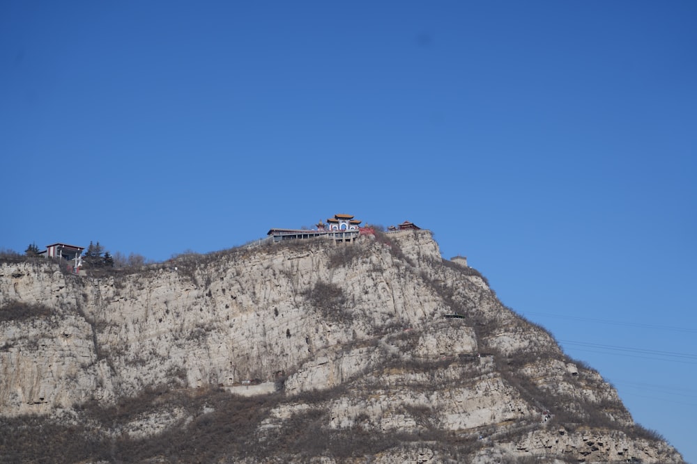 a mountain with a house on top of it