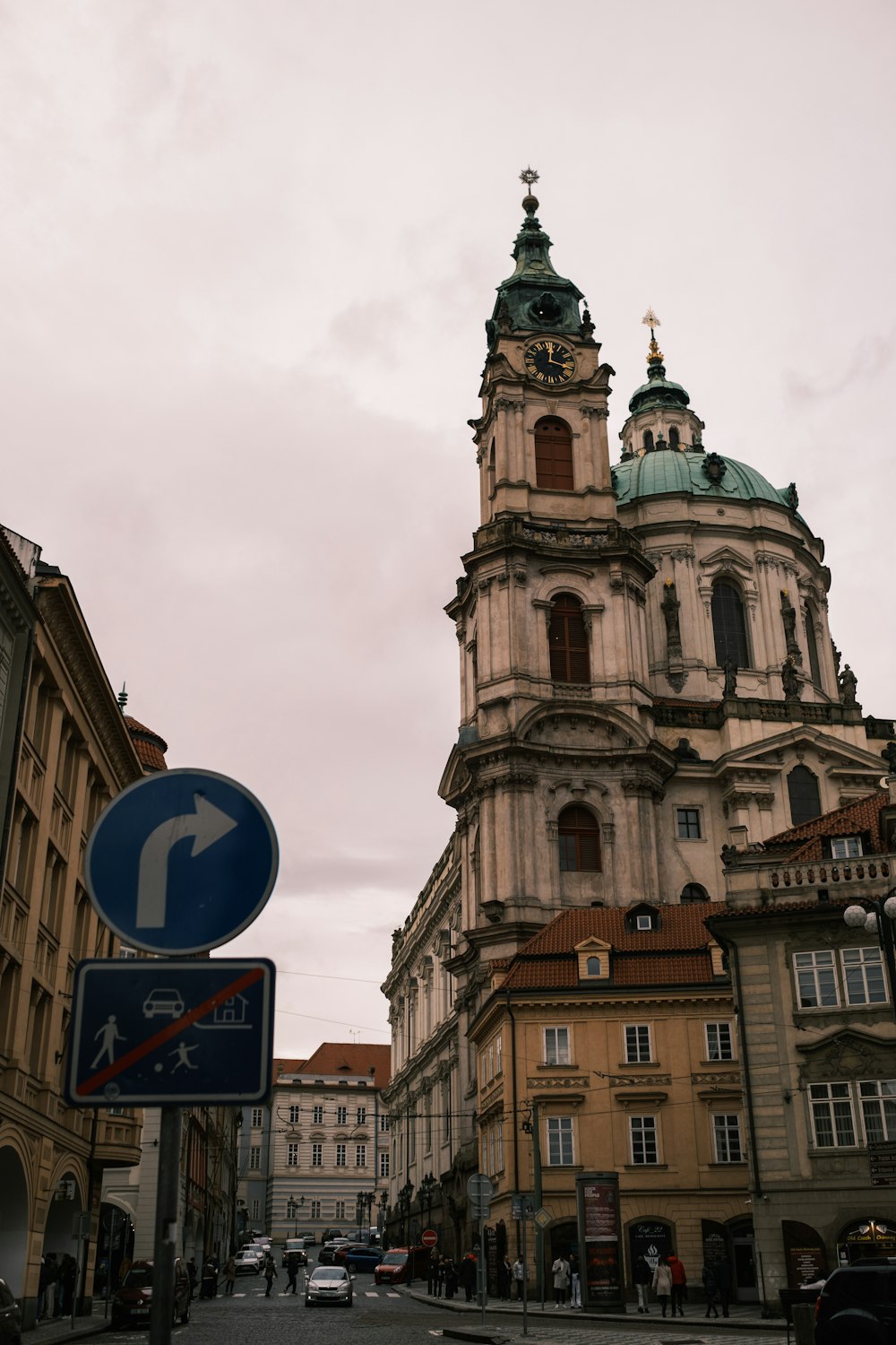 a street sign in front of a tall building