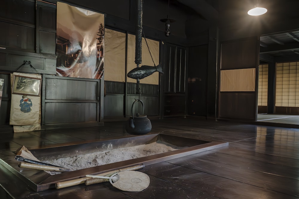 a room with a large metal container on the floor