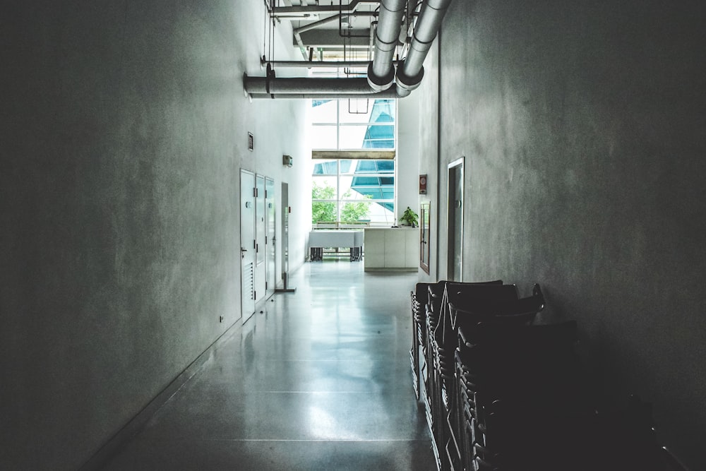 a long hallway with a bunch of boxes on the floor