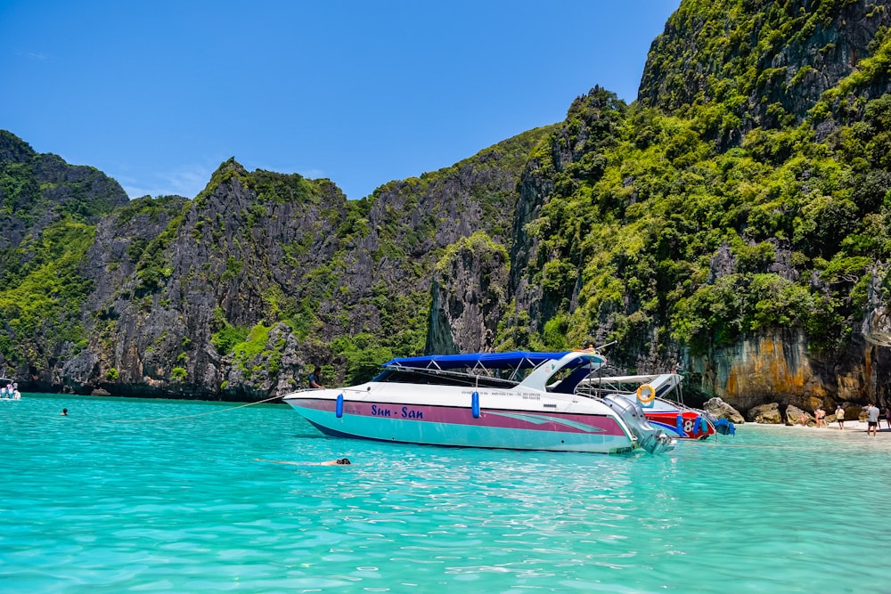 a boat in the water near a beach