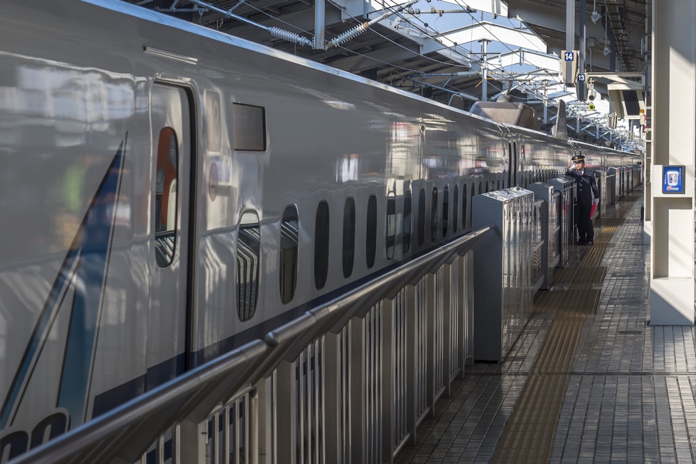 a passenger train stopped at a train station