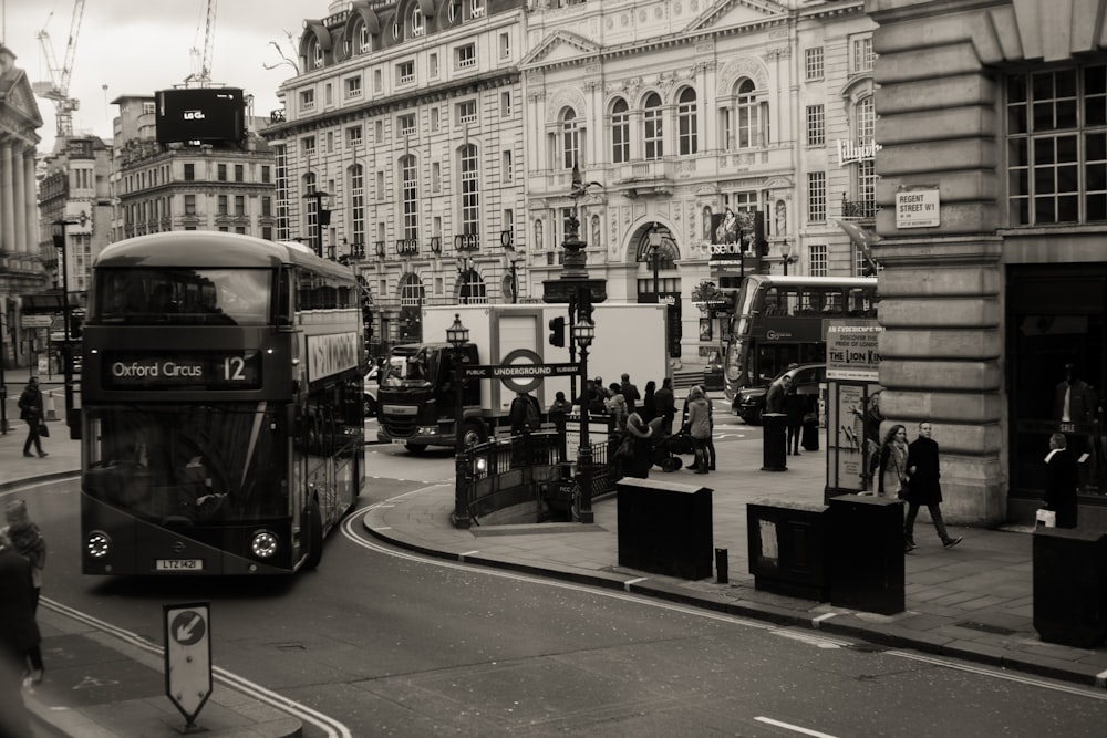 a double decker bus driving down a city street