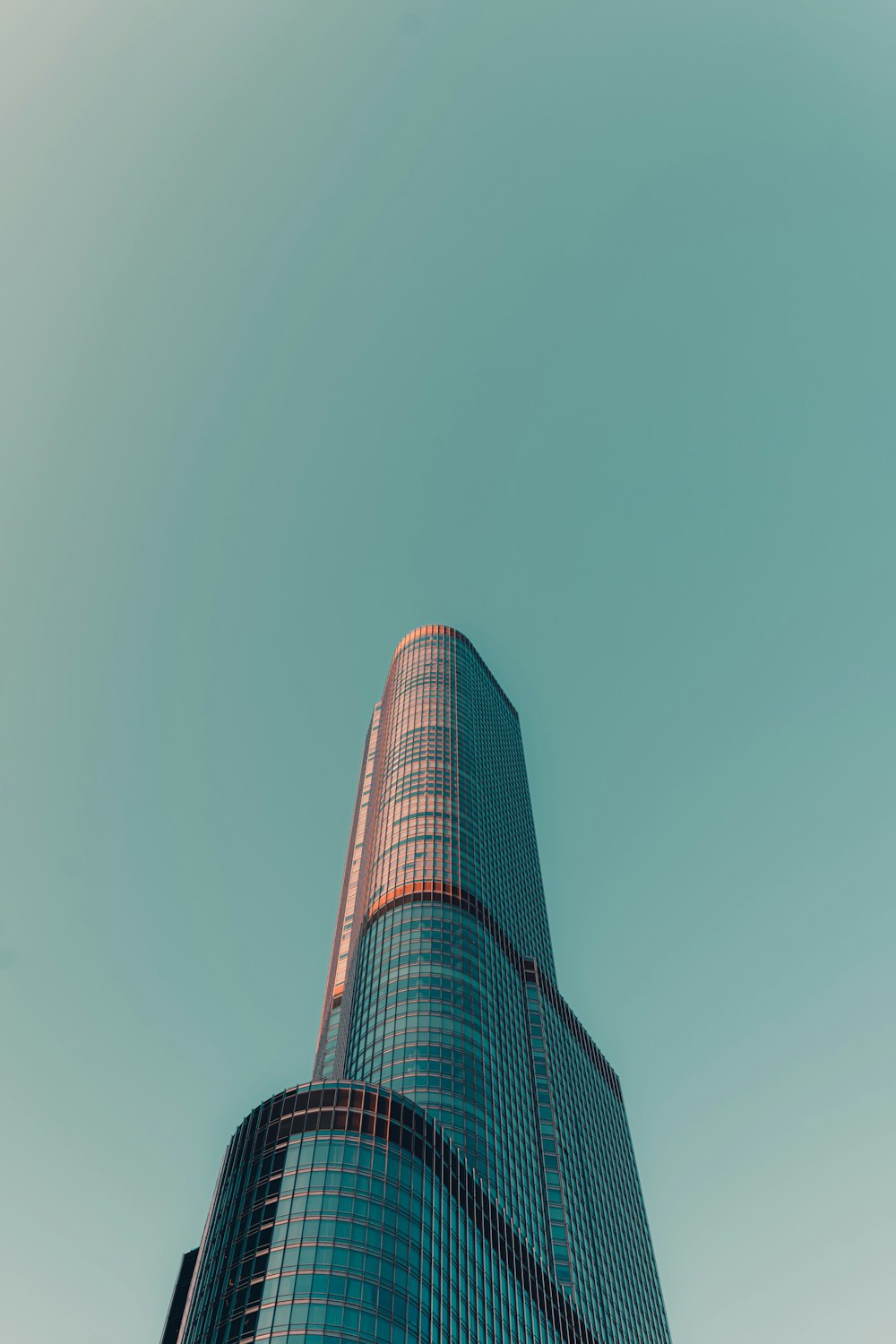 a very tall building with a sky background