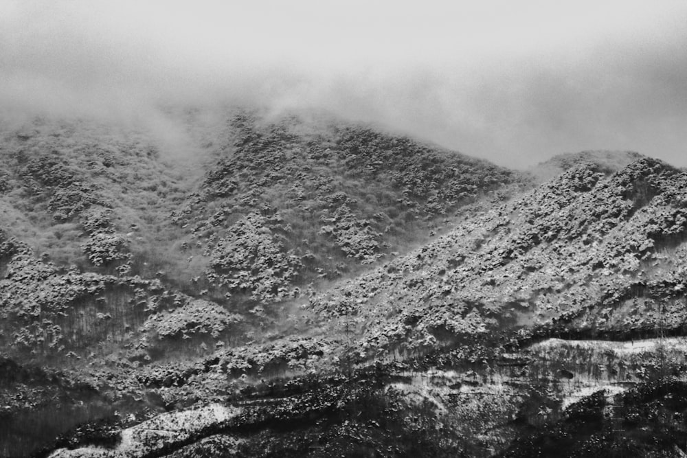 a black and white photo of a mountain range