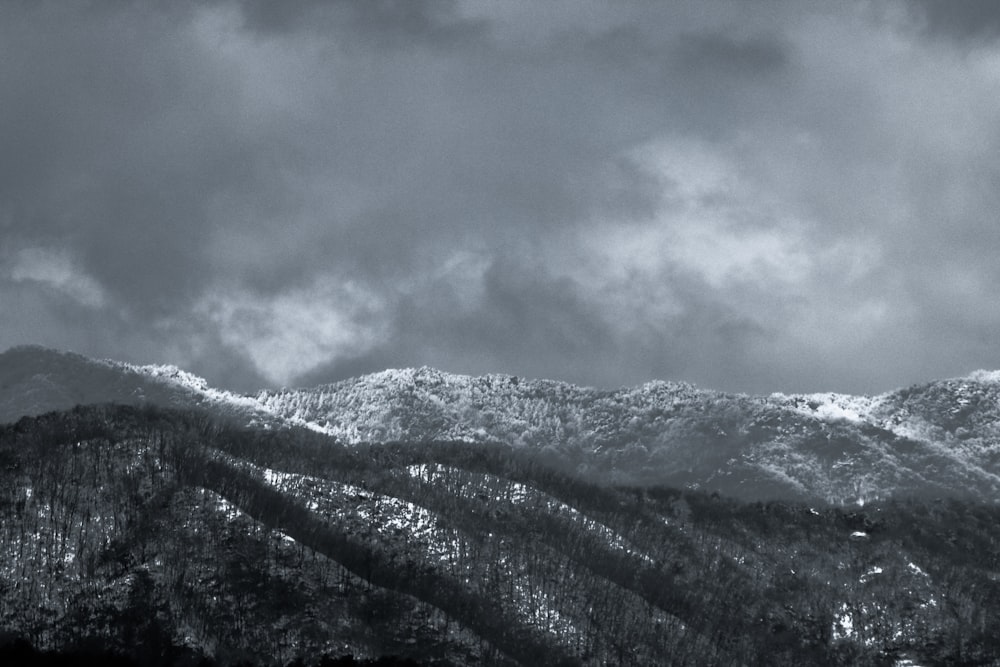 a black and white photo of a mountain range