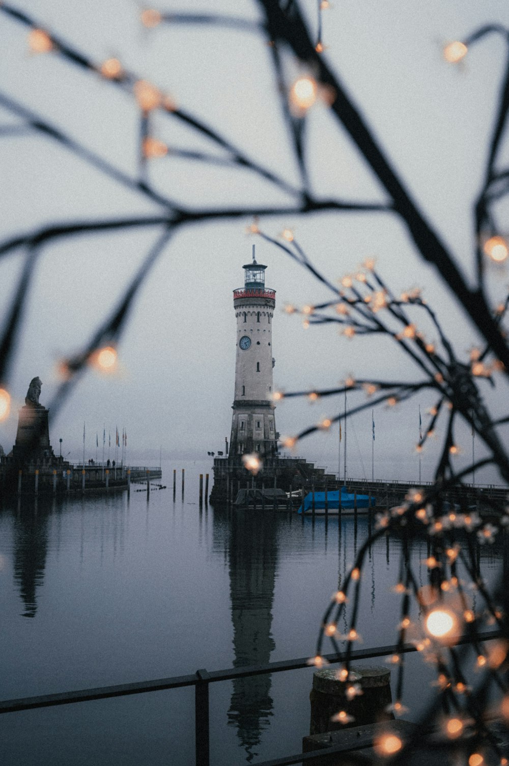 a light house sitting on top of a body of water