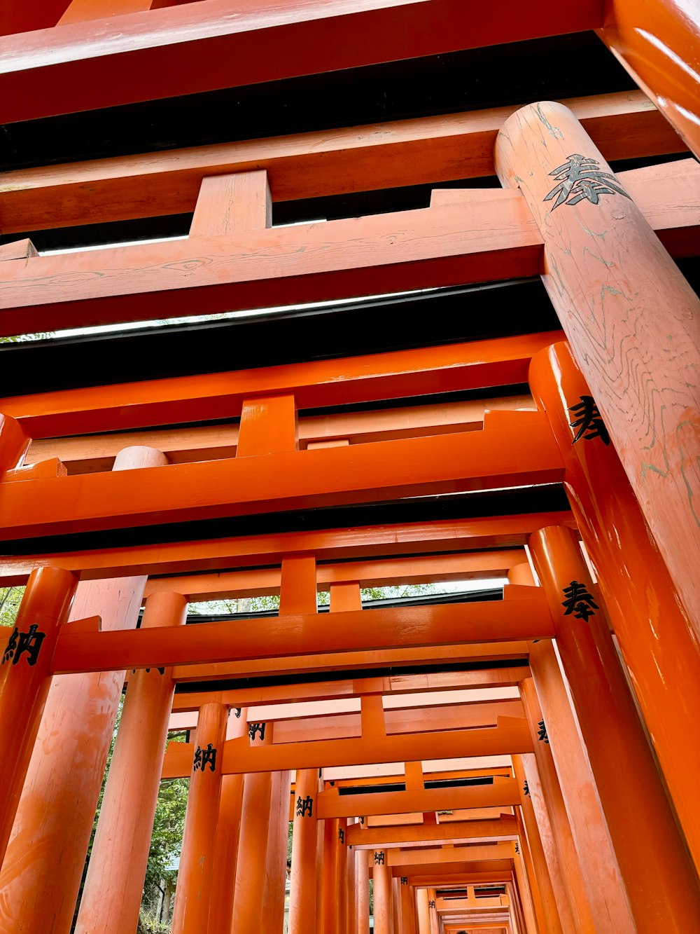 a tall orange structure with lots of columns