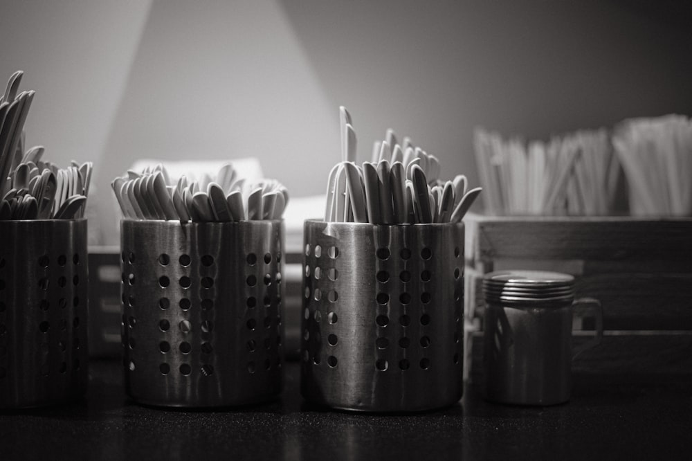 a black and white photo of toothbrushes and toothpaste