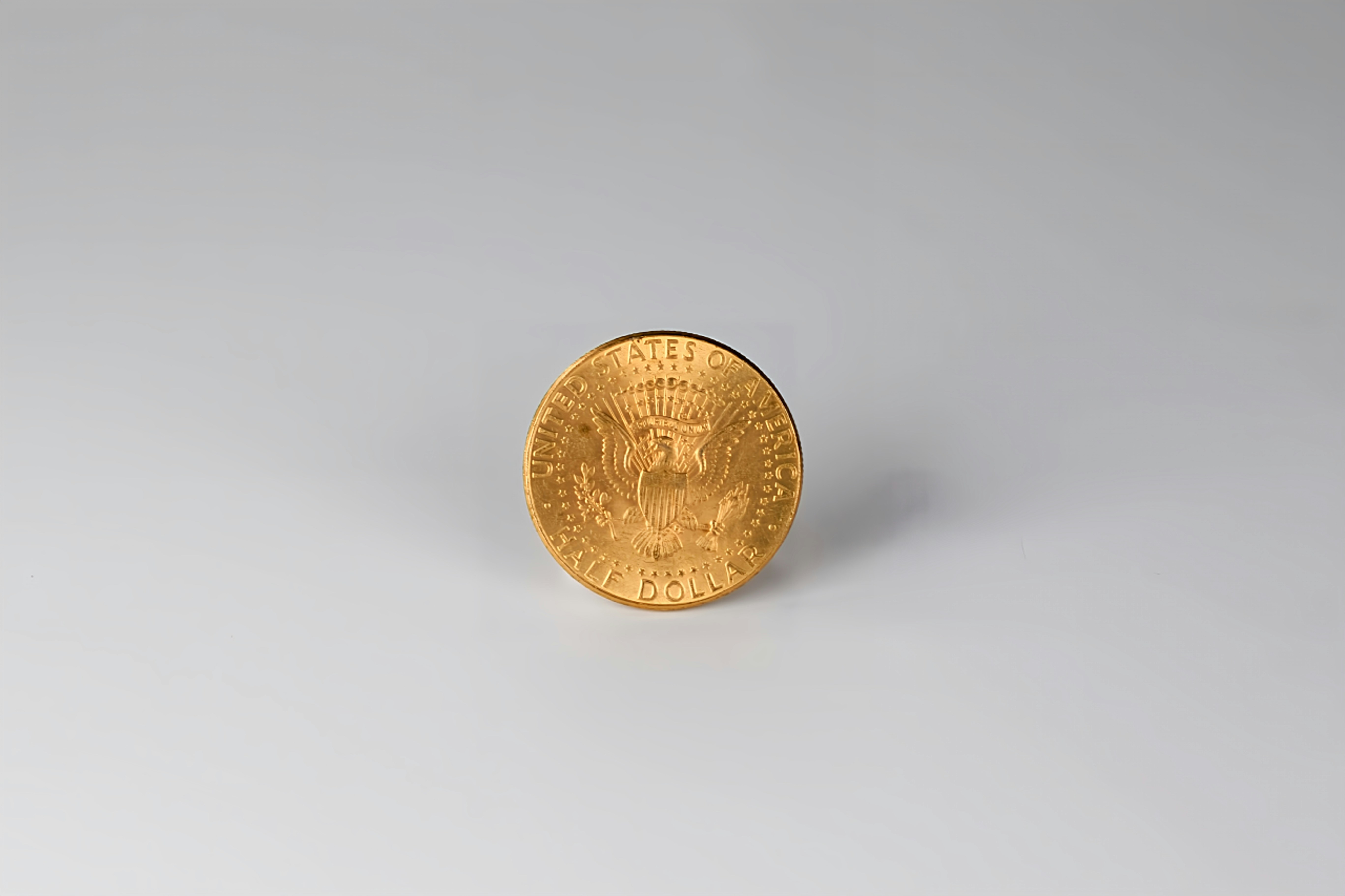 a close up of a coin on a white surface