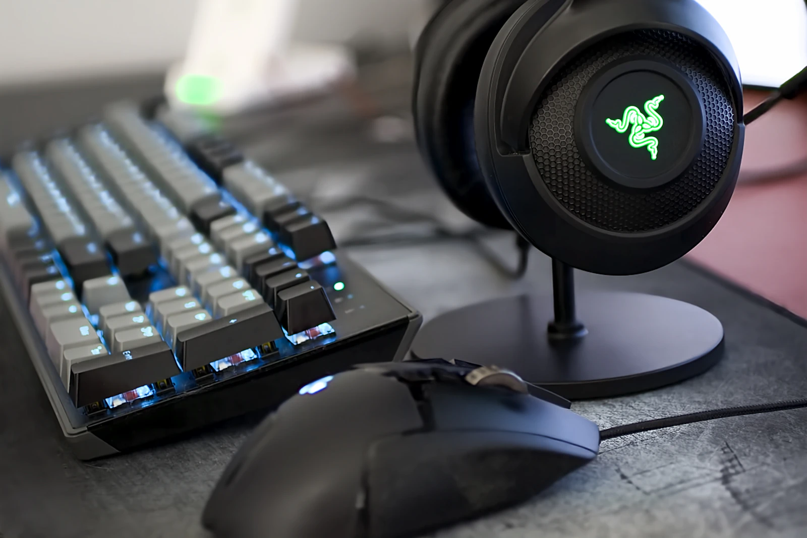 Gaming headset, mechanical keyboard, and mouse on a clean desk