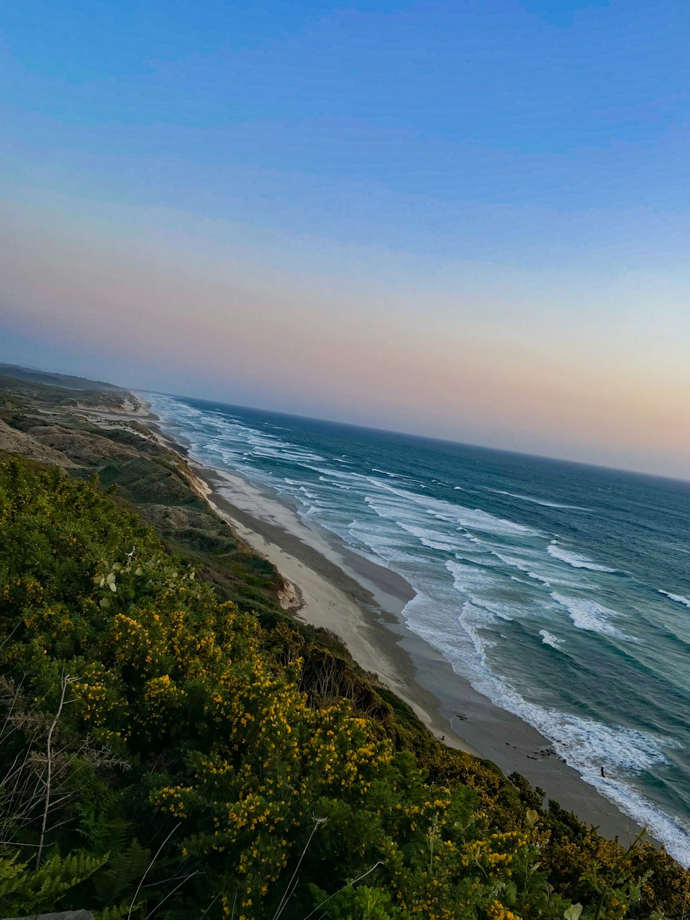 a view of the ocean from a cliff