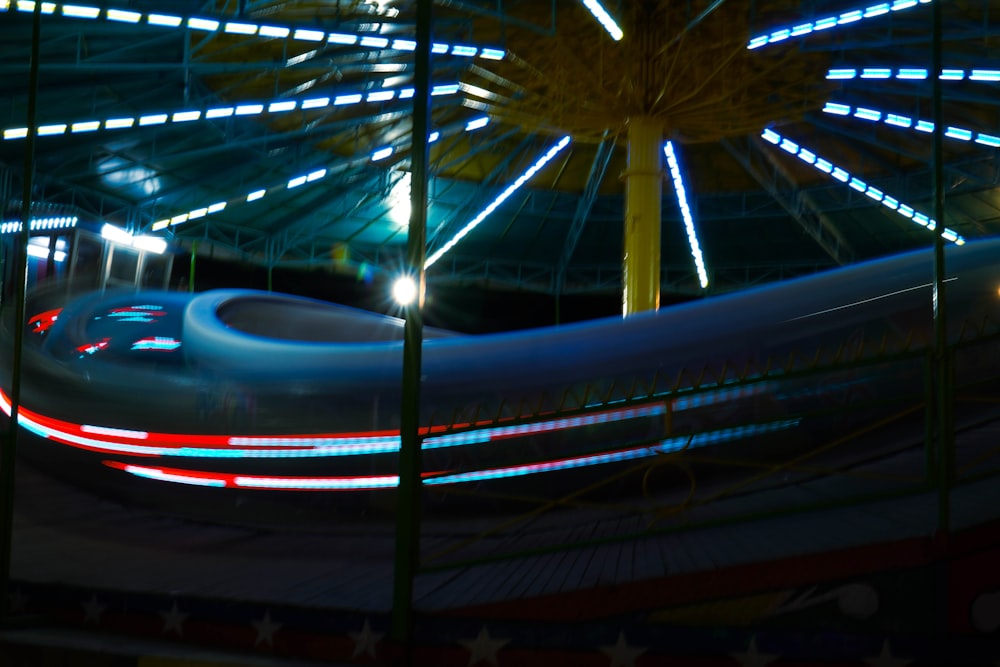 a ferris wheel at night with lights on