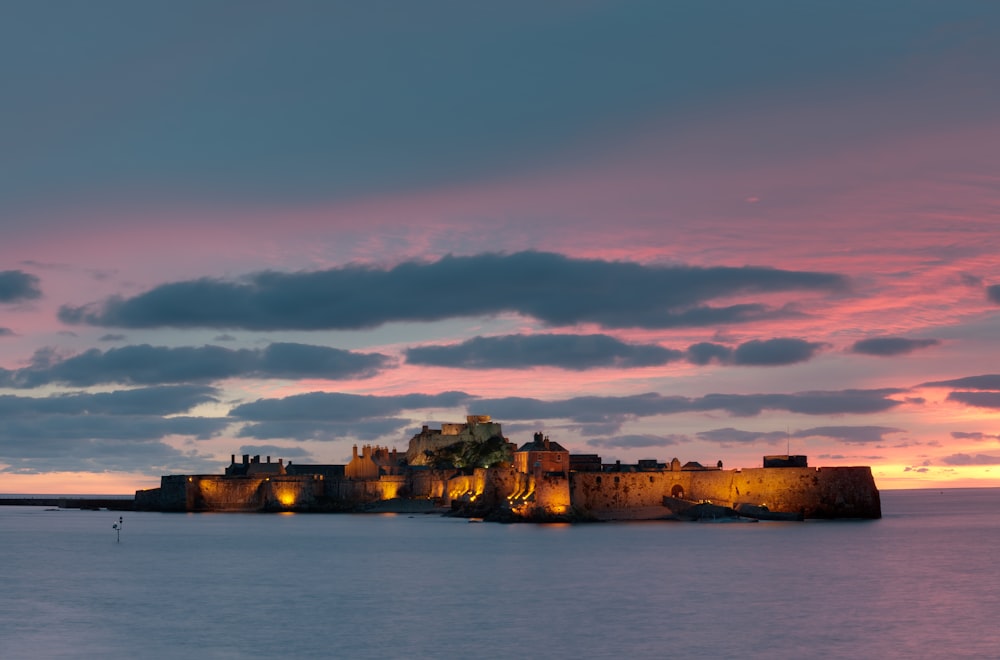 a castle sitting on top of a large body of water