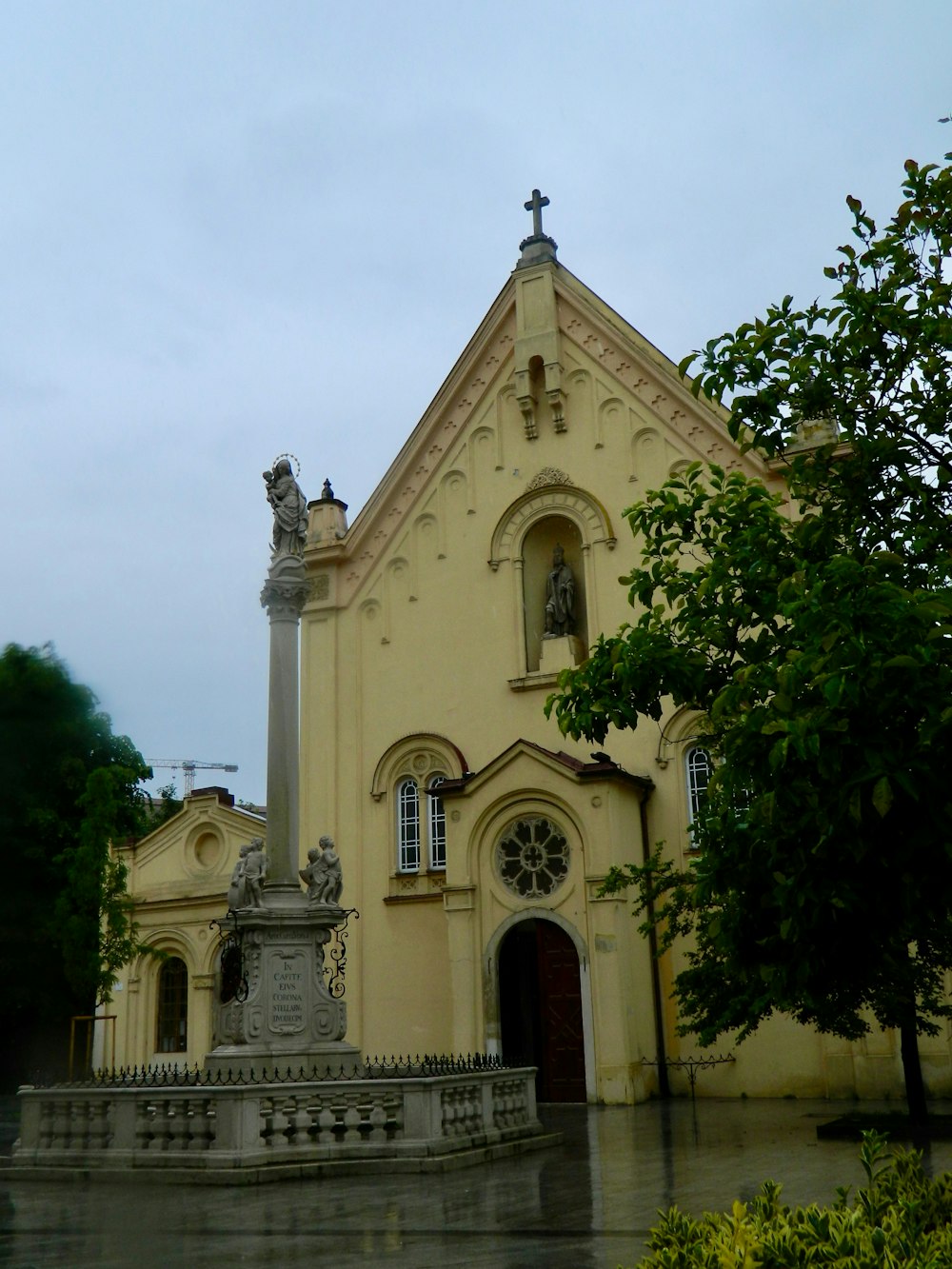 a church with a fountain in front of it