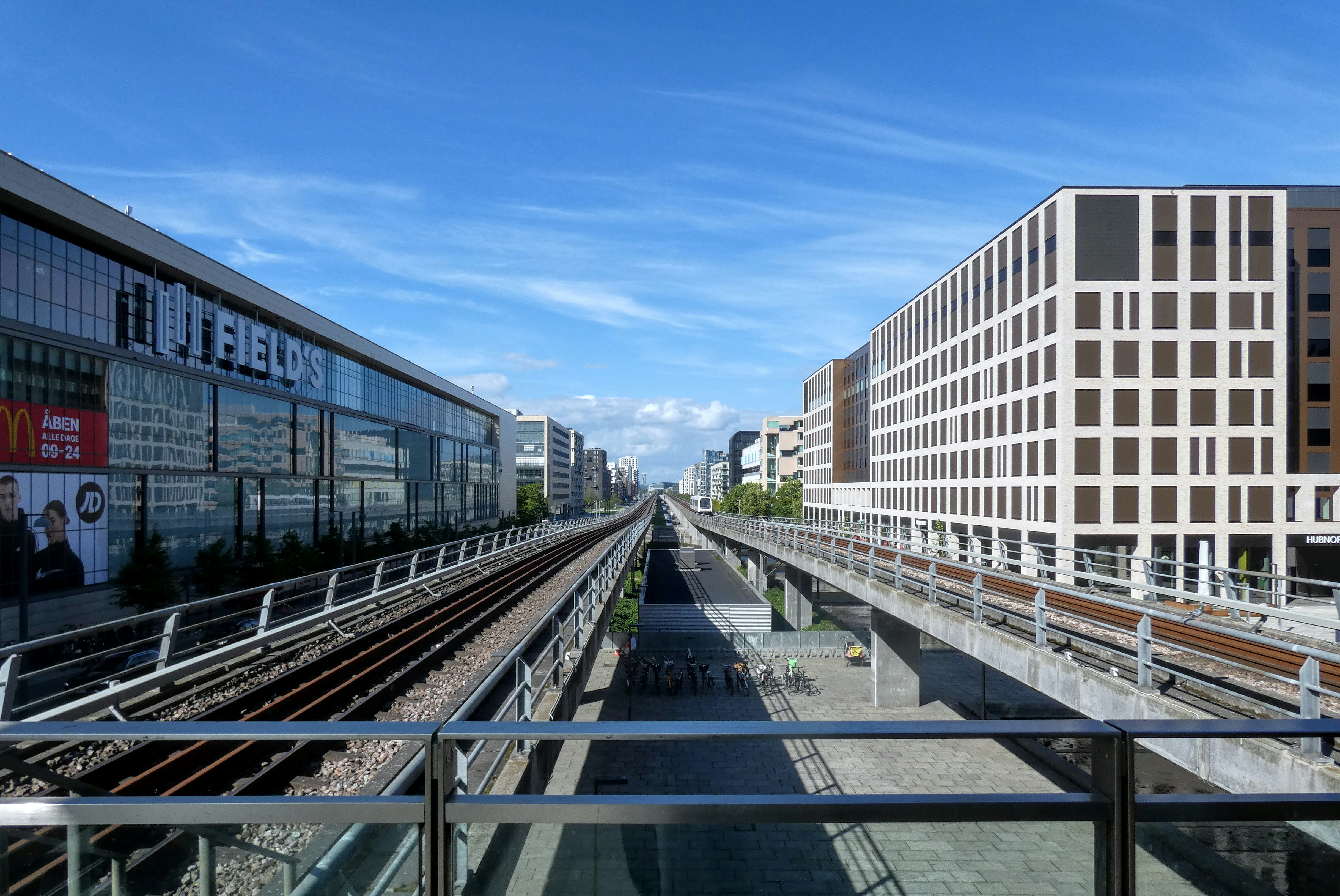 a view of a train track from a bridge