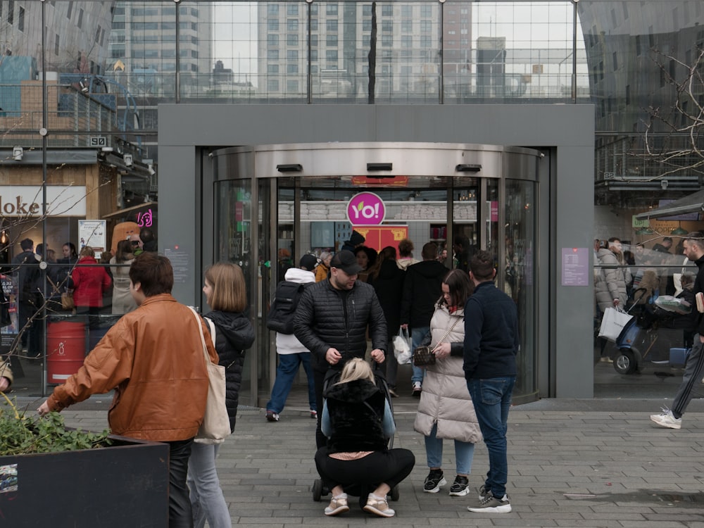 a group of people standing outside of a building