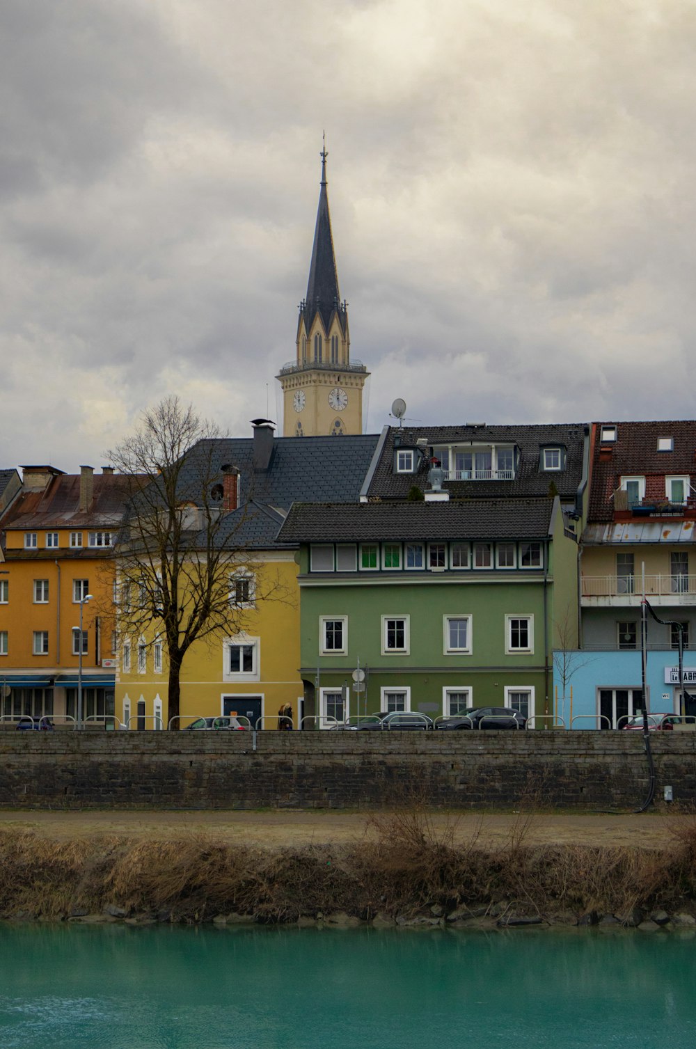 a group of buildings next to a body of water