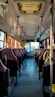 the inside of a bus with empty seats