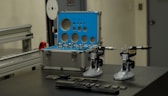 a couple of machines sitting on top of a table