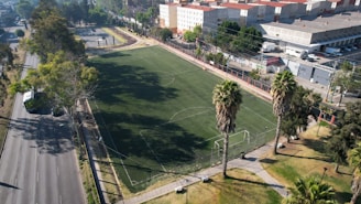 an aerial view of a soccer field in a city
