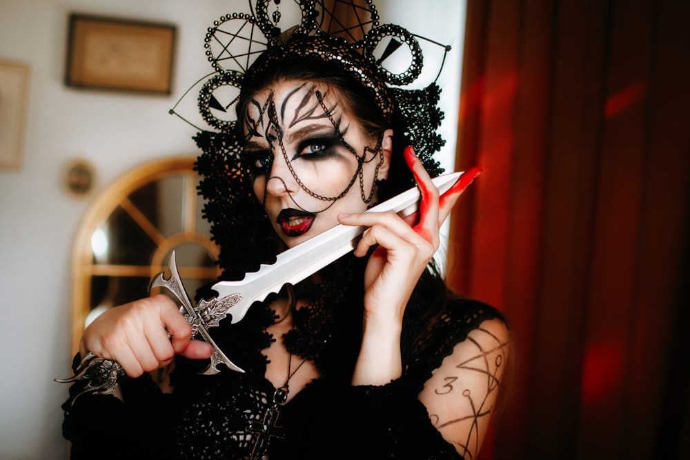 a woman in a costume holding a pair of scissors