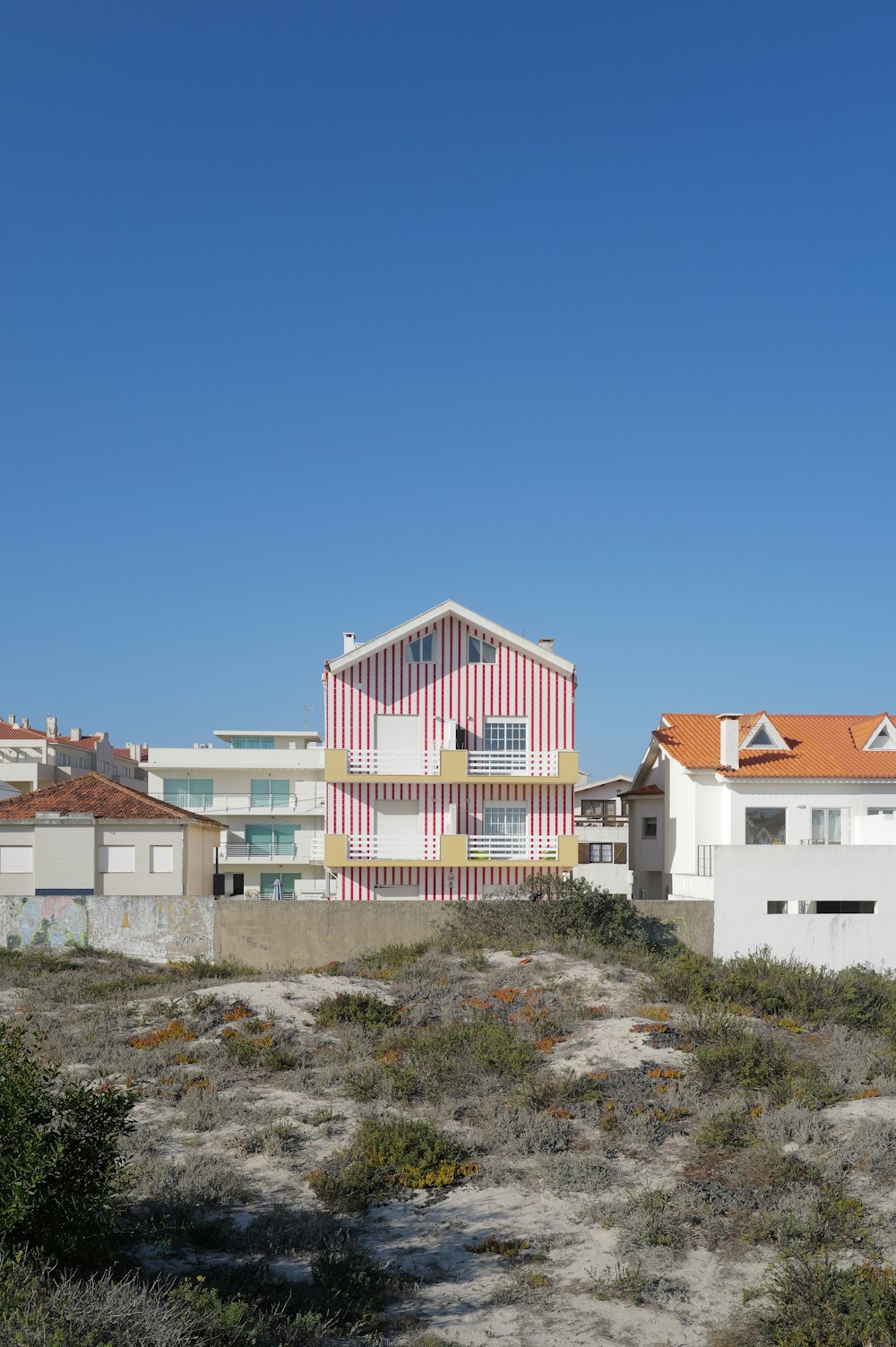 a building with a red and white stripe on it