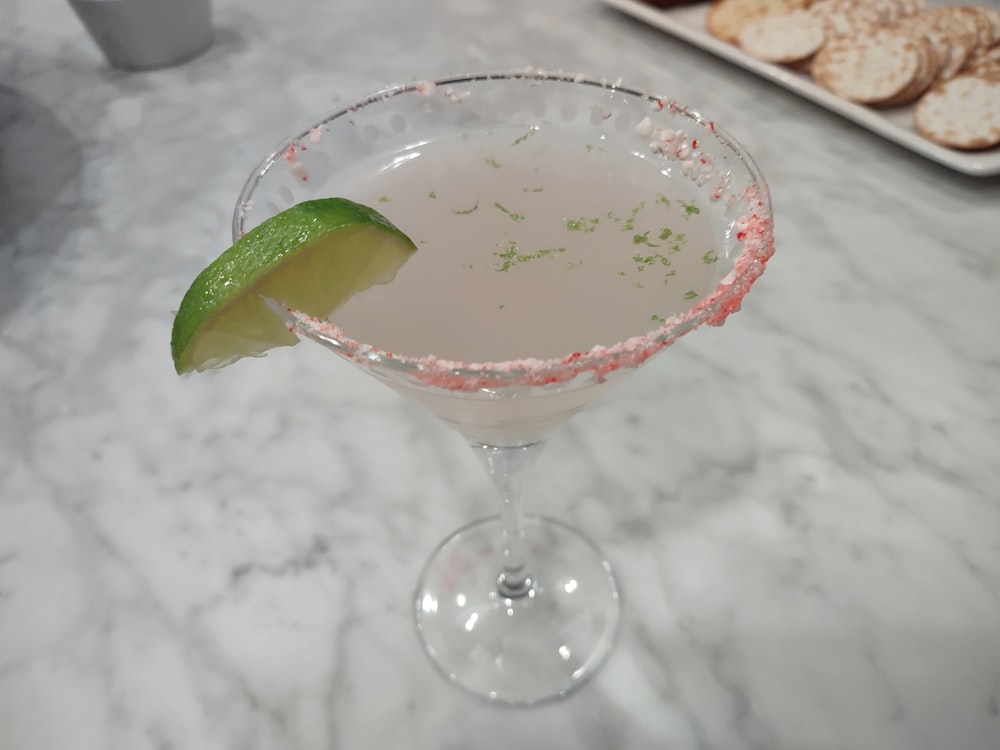 a close up of a drink in a glass on a table