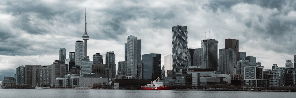 a large body of water with a city in the background