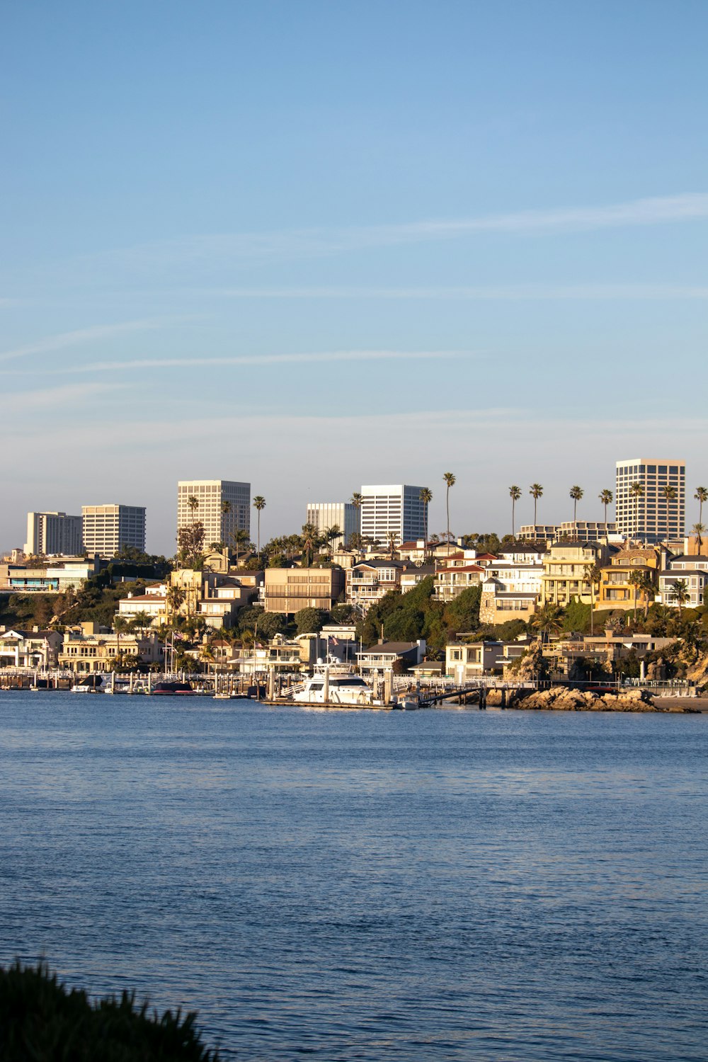 a body of water with a city in the background