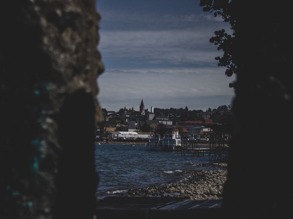 a view of a body of water with a city in the background