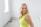 a woman in a yellow dress posing for a picture