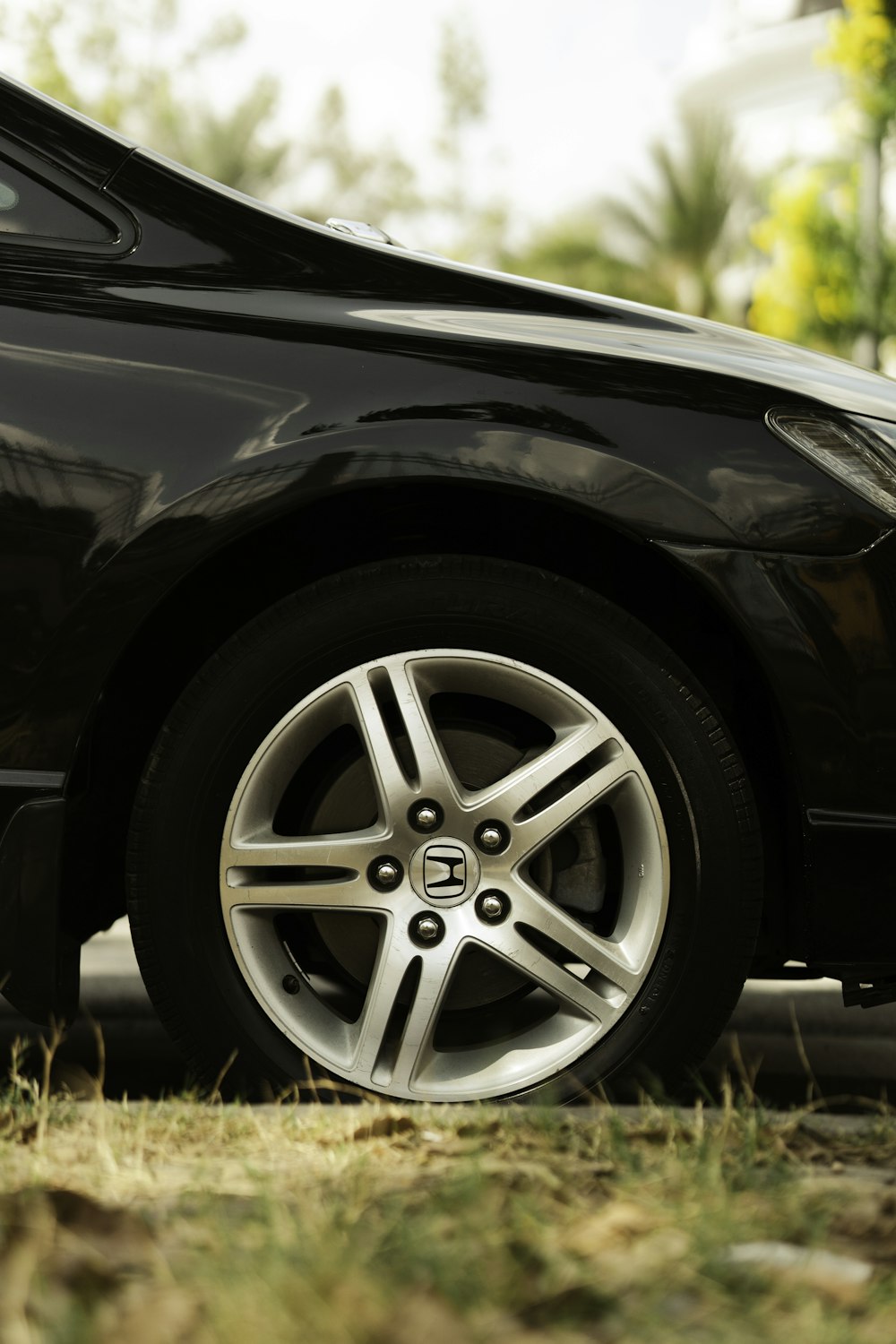 a black car parked on the side of the road