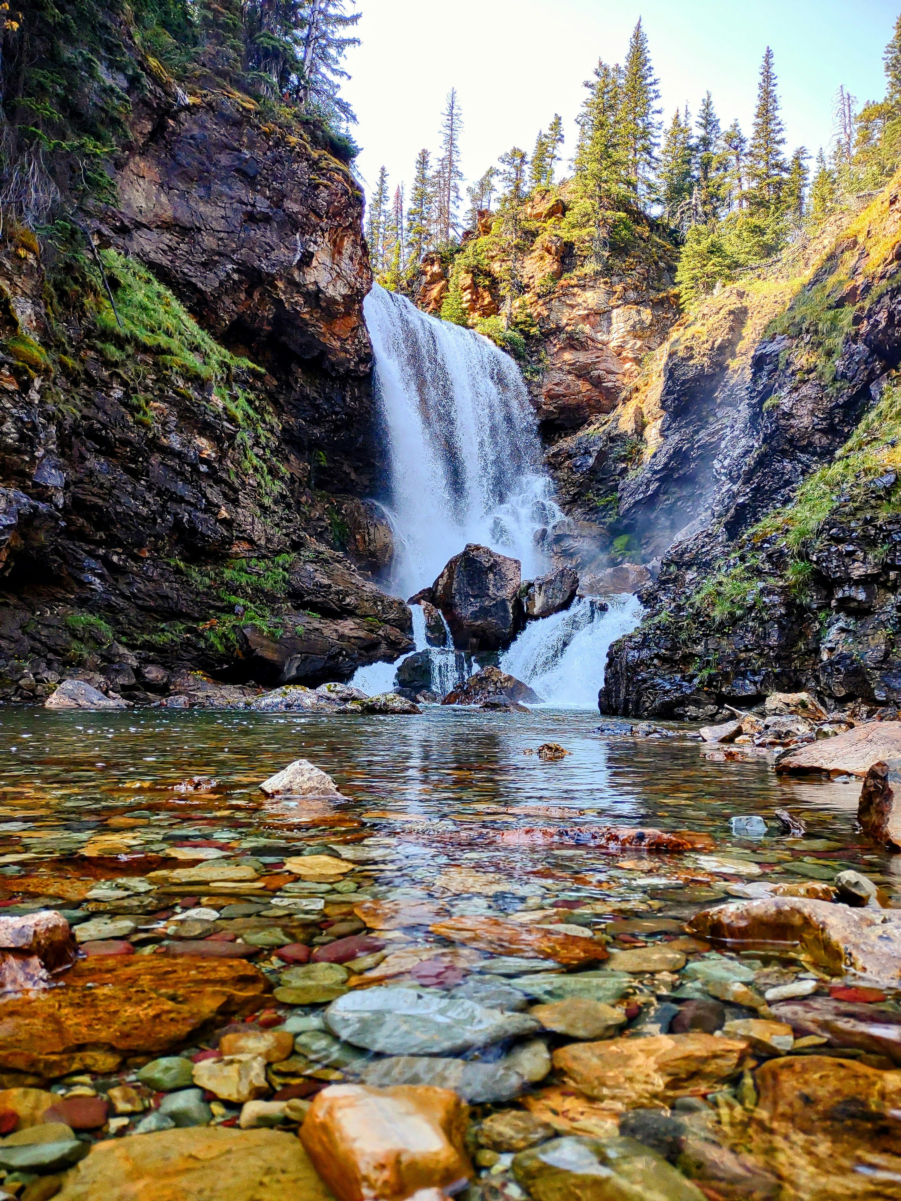 a large waterfall with a waterfall in the middle of it