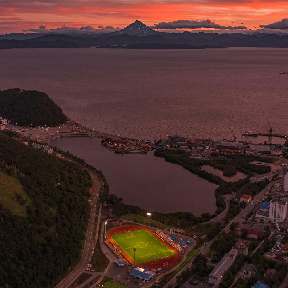 an aerial view of a baseball field at sunset