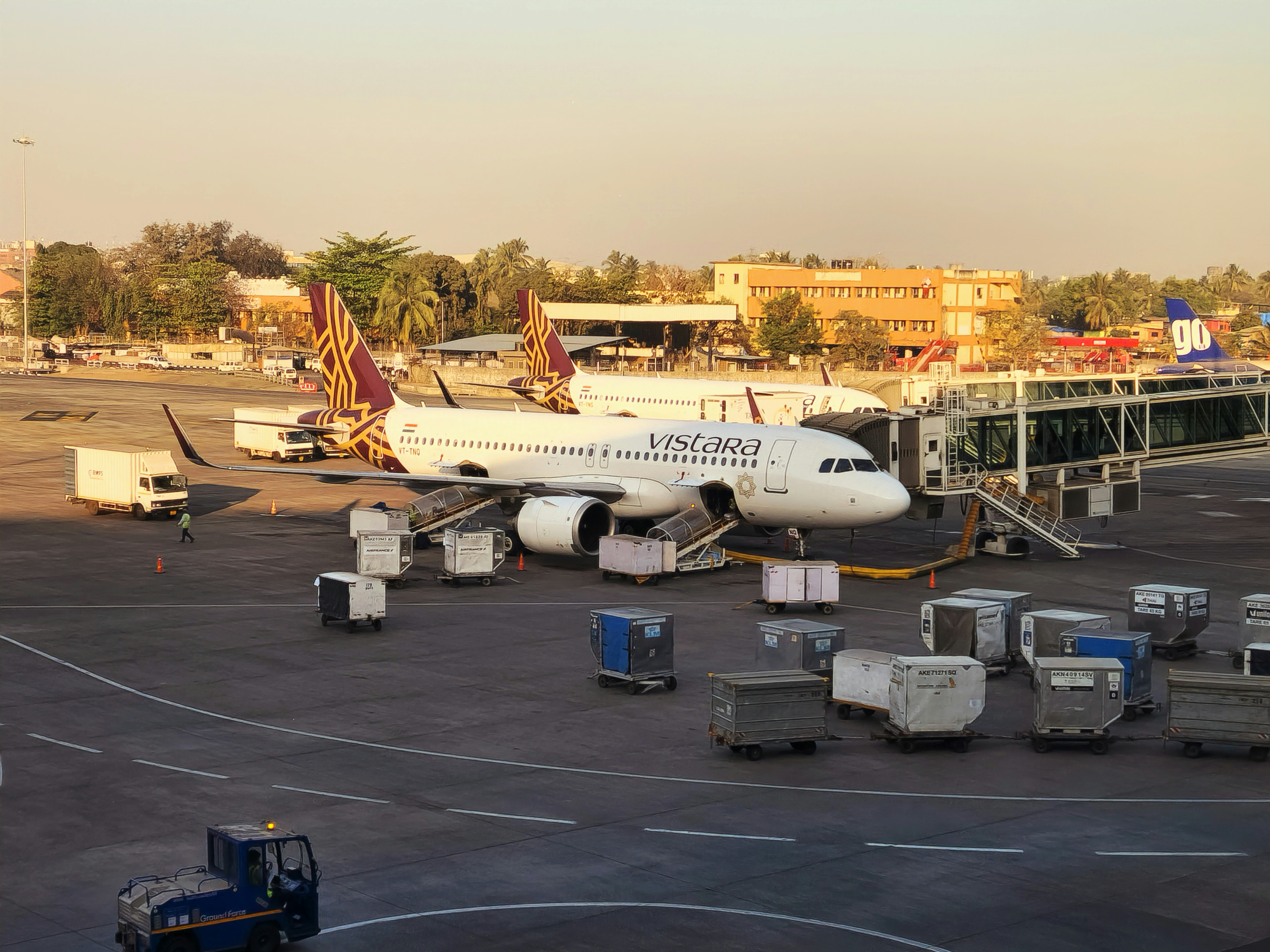 a large jetliner sitting on top of an airport tarmac, A Vistara aeroplane at Chhatrapati Shivaji Maharaj International Airport (BOM), Mumbai, Maharashtra, India