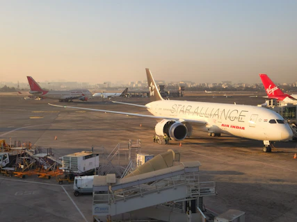 a large jetliner sitting on top of an airport tarmac
