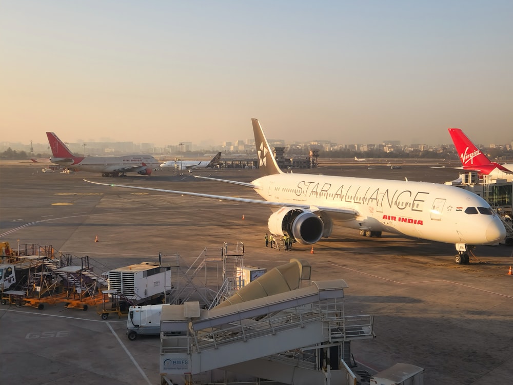 a large jetliner sitting on top of an airport tarmac