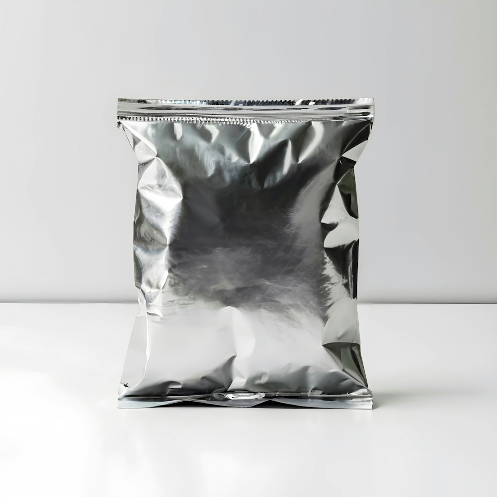 a silver foil bag sitting on top of a white table