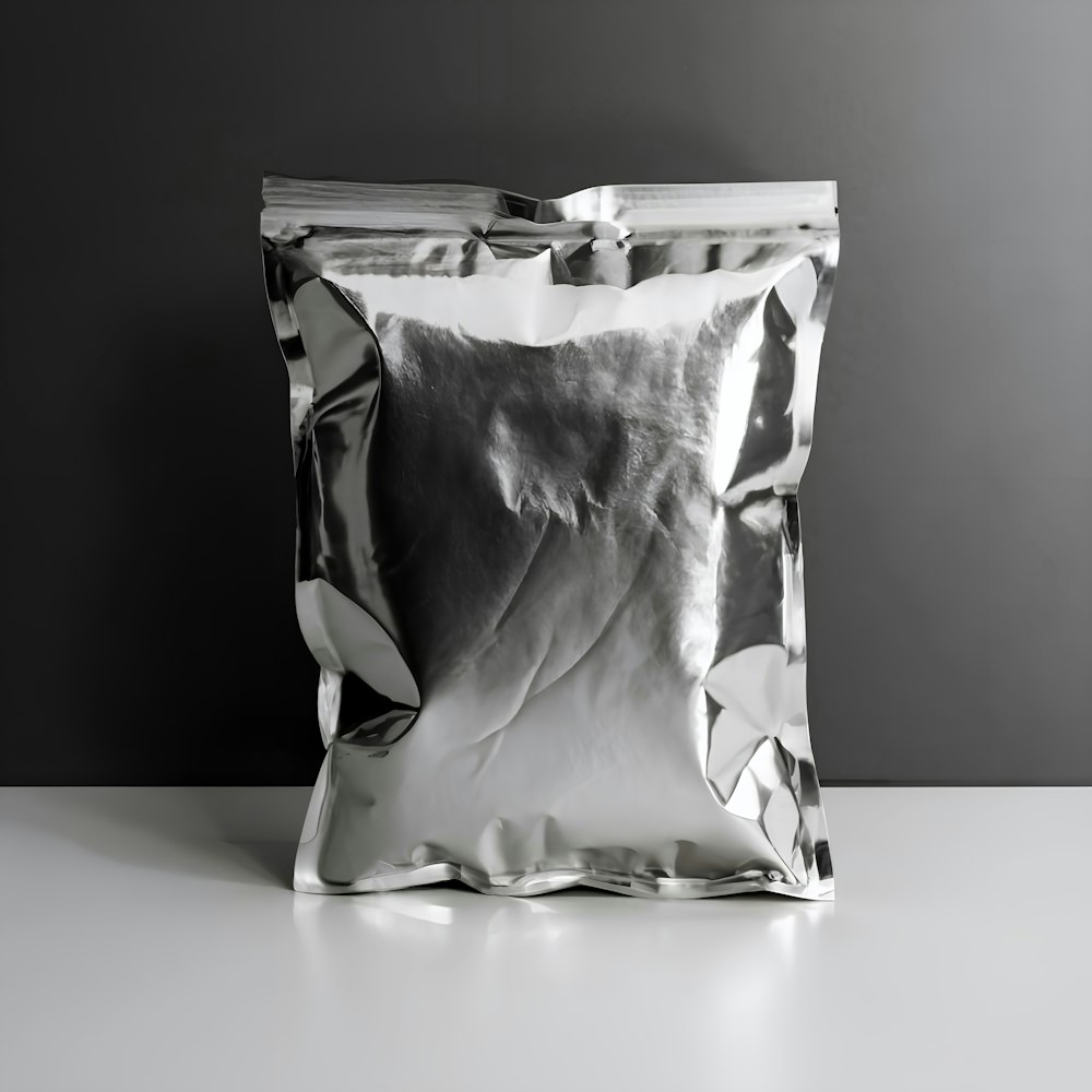 a silver foil bag sitting on top of a white table