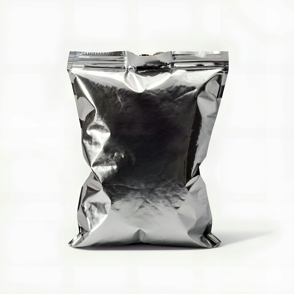 a bag of silver foil on a white background