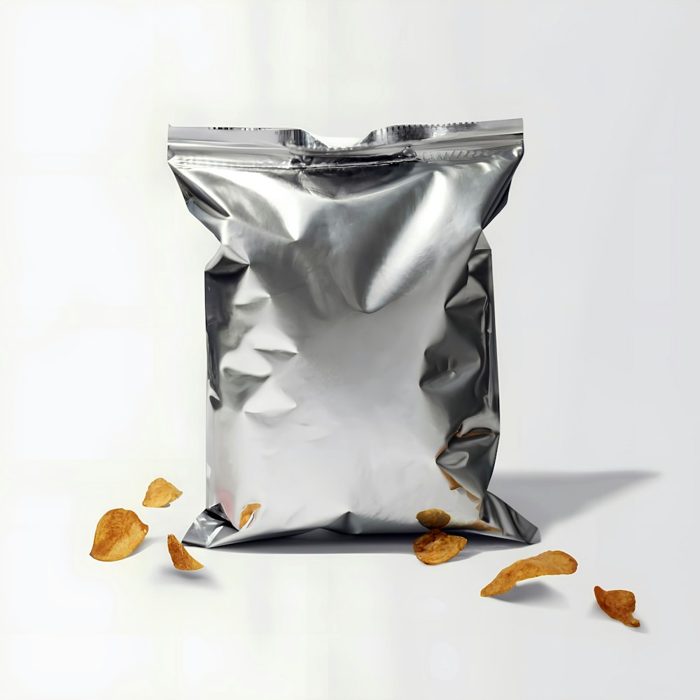 a silver bag of chips on a white background