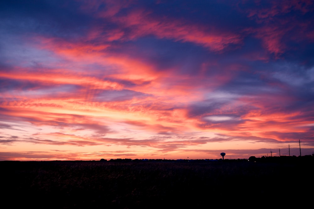 a colorful sunset with clouds in the sky