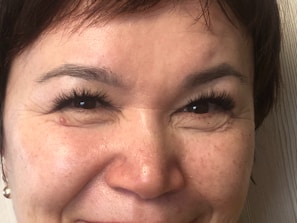 a close up of a person smiling for the camera