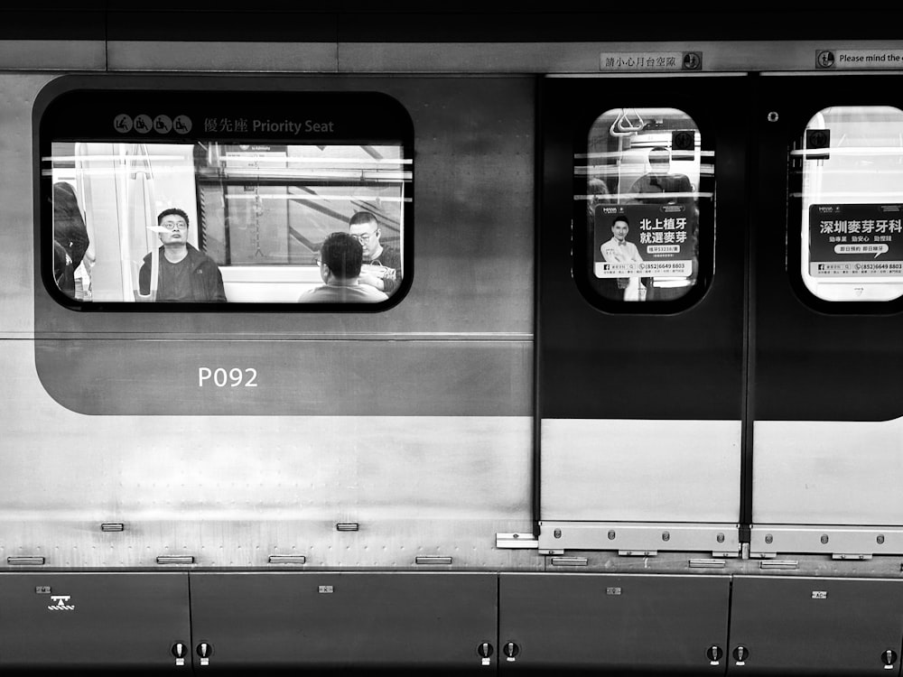 a black and white photo of a subway train