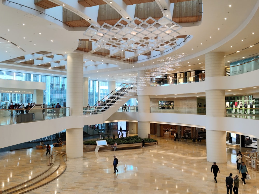 a group of people walking around a large building