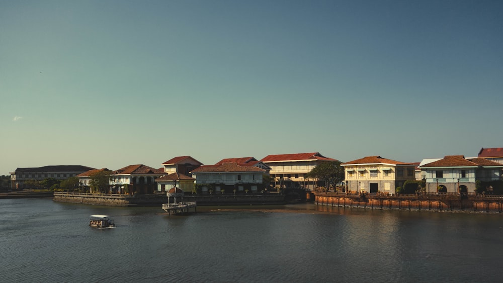 a row of houses on the side of a river